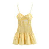 Yellow checkered dress with thin straps on a white background